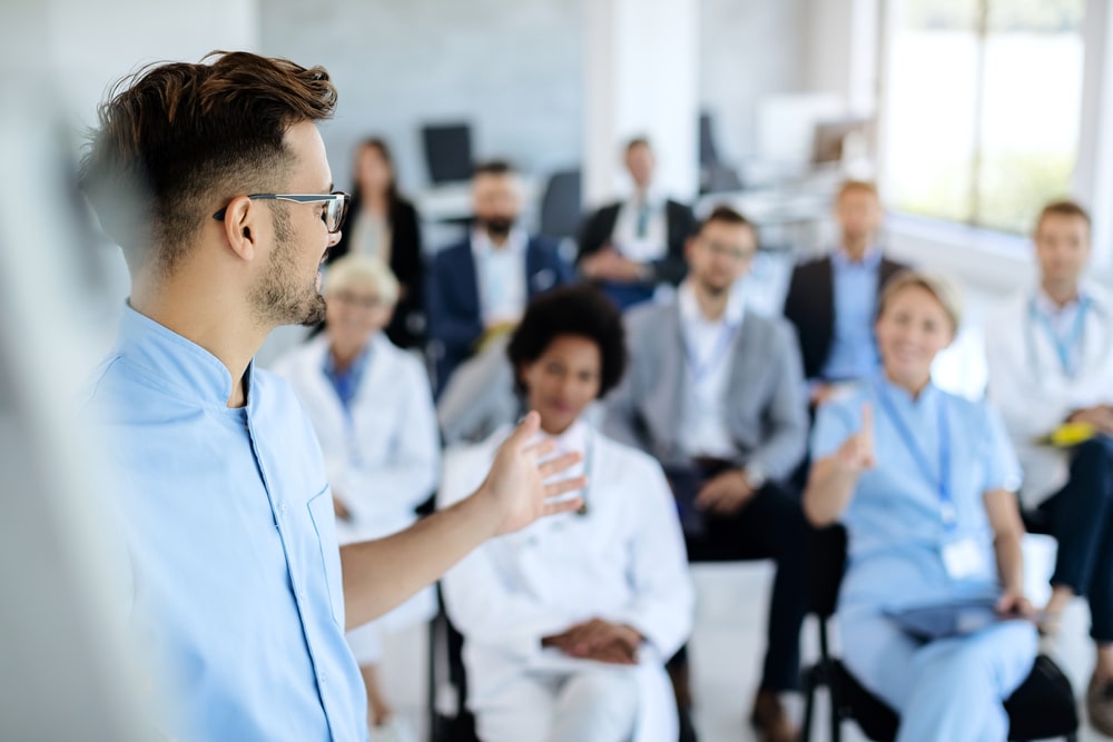 Professor giving a lecture to students in a classroom