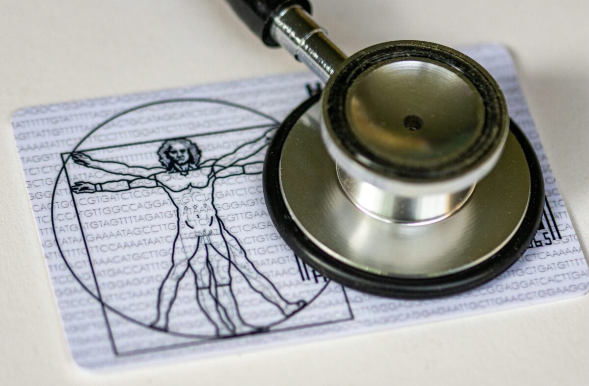 Stethoscope on top of an image of Da Vinci’s Vitruvian Man