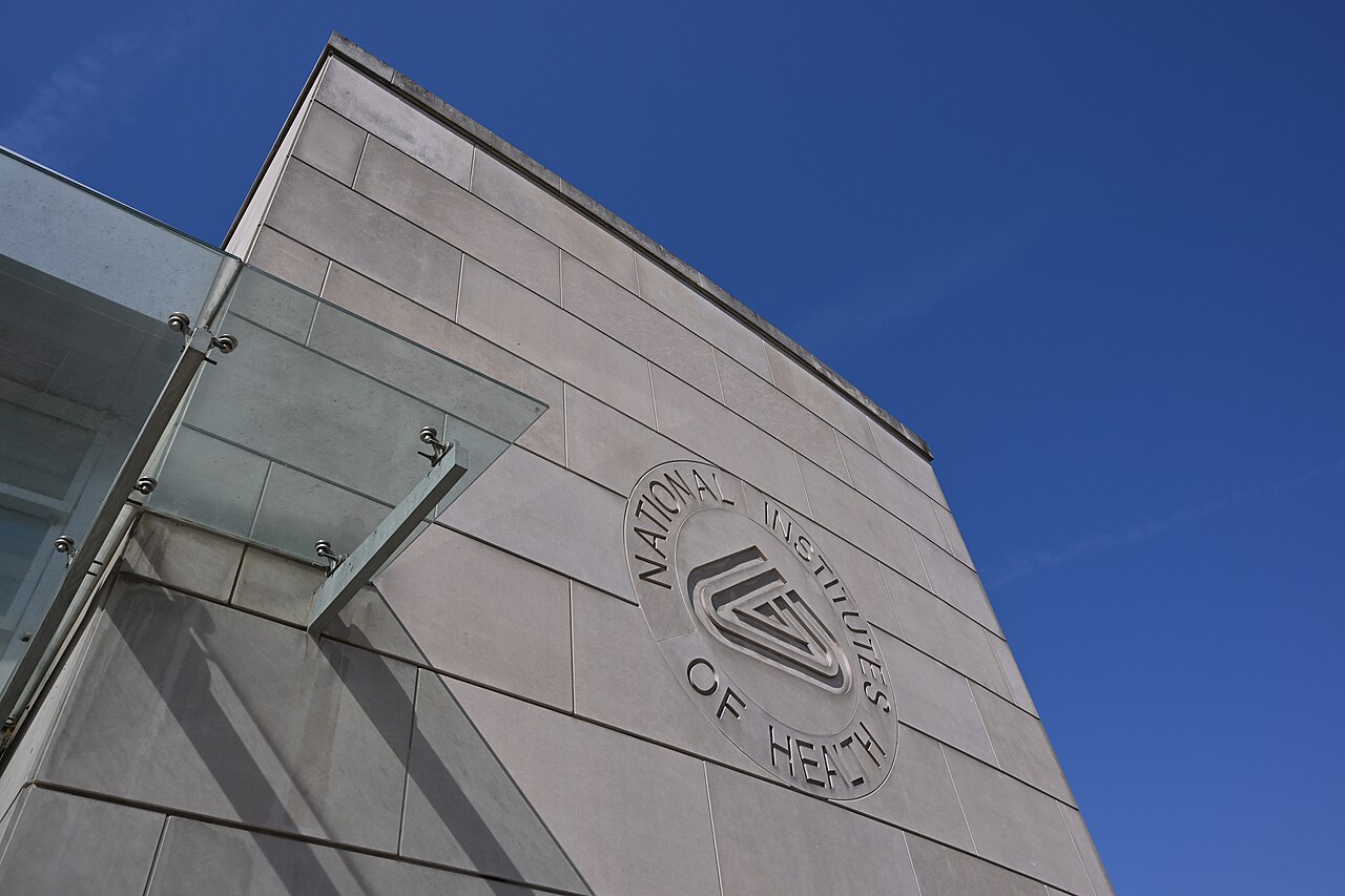 The NIH logo is engraved in stone—or more likely concrete—on the wall of the NIH Gateway Center, the main visitor entrance to Building 66 at 9000 Rockville Pike, Bethesda, Maryland 20892