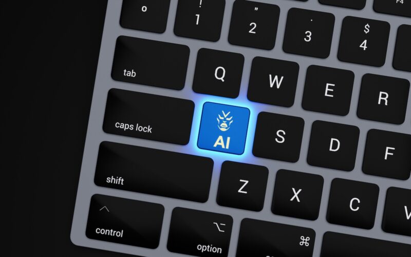 Close-up of a computer keyboard with a glowing blue AI key.