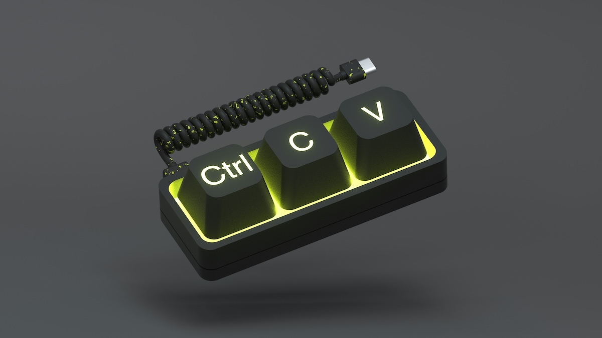 Ilustração digital em fundo cinza-escuro mostra três teclas de teclado mecânico iluminadas em amarelo-esverdeado, com as inscrições "Ctrl", "C" e "V", conectadas a um cabo em espiral trançado preto e amarelo com conector USB-C.