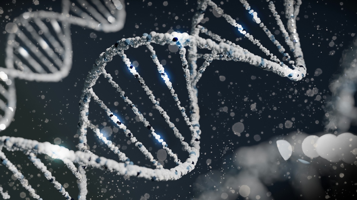 Renderização digital em tons de azul e branco de uma molécula de DNA em forma de dupla-hélice, em close-up, com partículas de luz e brilho dispersas ao fundo escuro, sugerindo um ambiente microscópico.